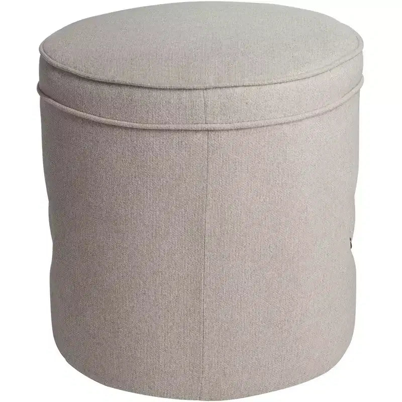 Pouf rotondo rivestito con borchie decorative